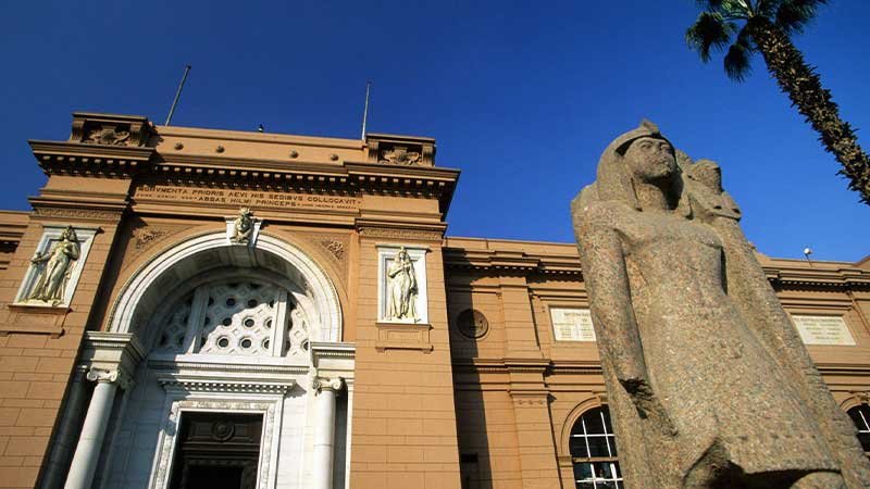 A picture of the front of the ancient Egyptian Museum for a tourist